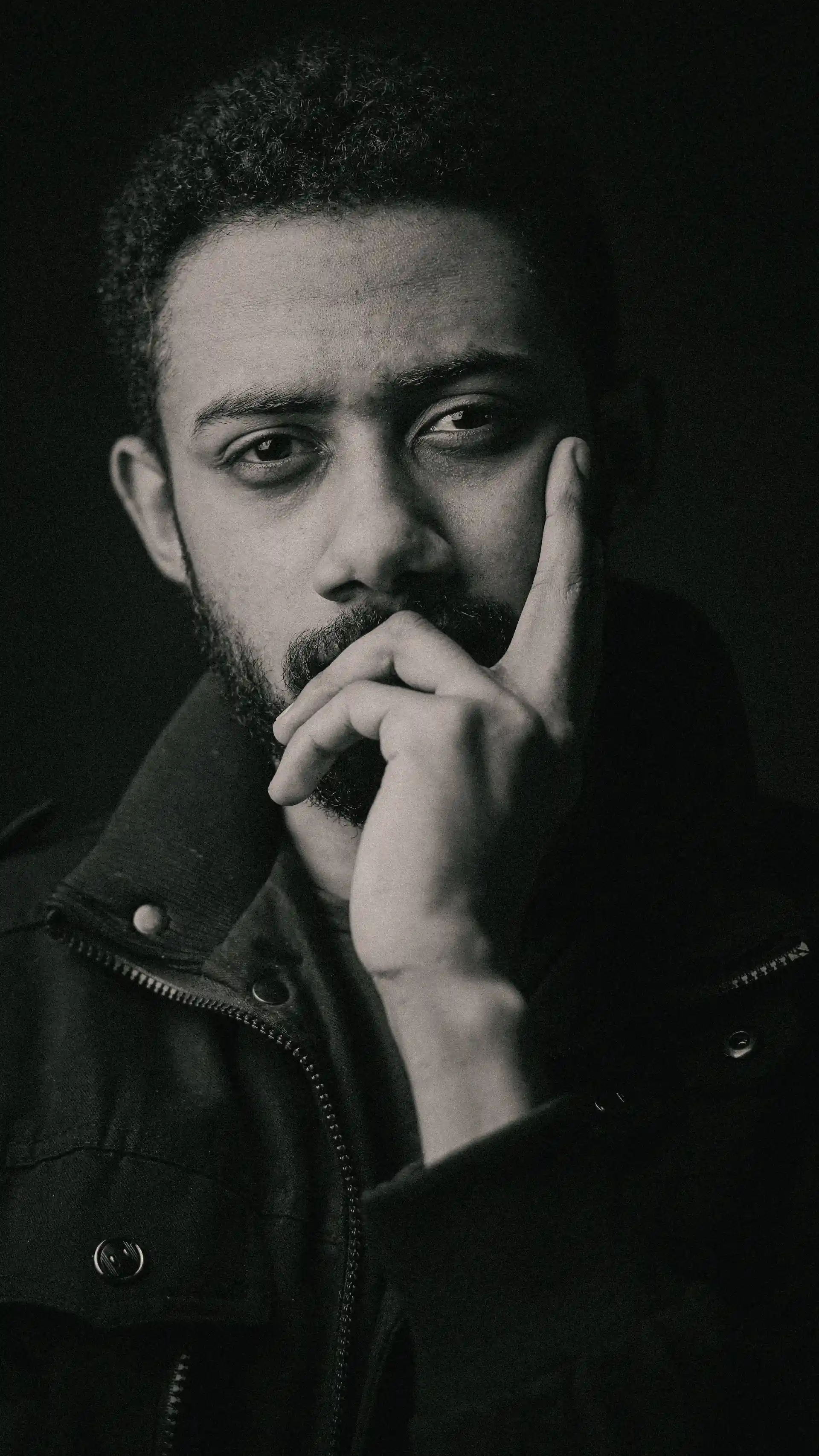 Person in thoughtful pose